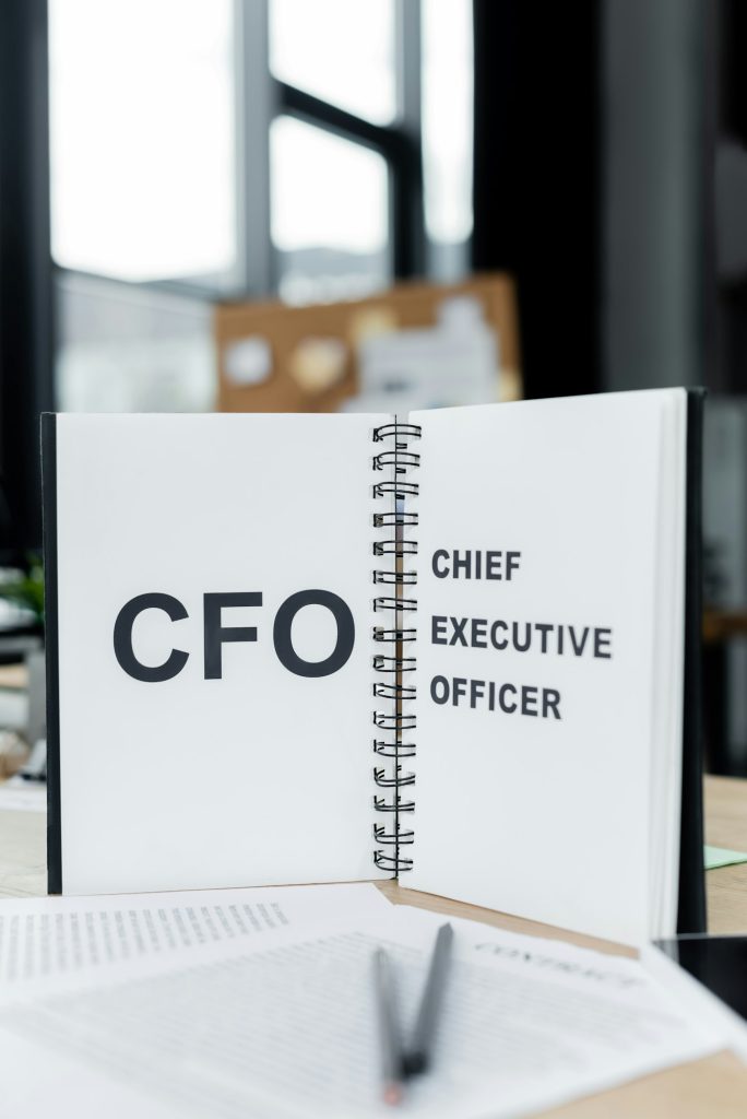 notebook with cfo and chief executive officer lettering on desk